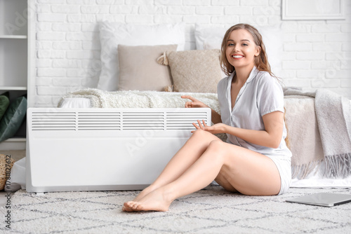 Young woman with radiator i...