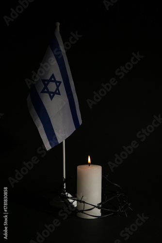 Burning candle with barbed ...