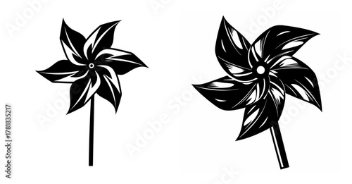 Two stylized pinwheels on sticks showing dynamic spinning motion captured in ink style