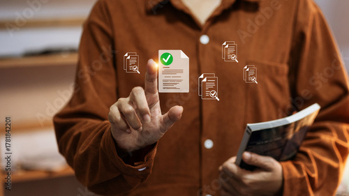 Person using digital document verification system with online approval and paperless concept