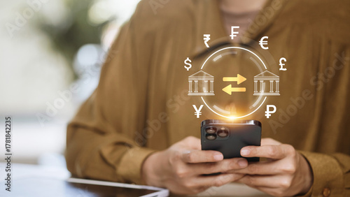 Person using smartphone for digital banking with global currency exchange and fintech concept