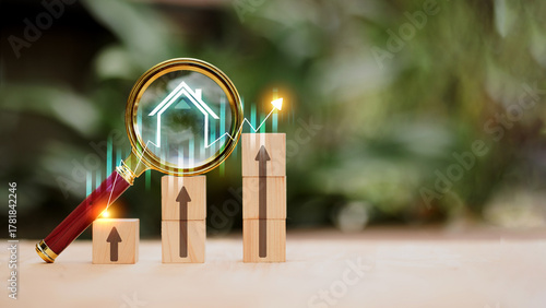 Real estate investment growth with magnifying glass and increasing bar graph concept