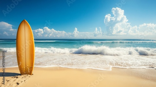 A yellow surfboard stands upright on a sandy beach with turquoise ocean waves and fluffy white clouds in a vibrant blue sky, creating an inviting summer scene