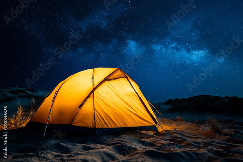 Fototapeta Naklejka Na Ścianę i Meble -  tent in the Sahara Desert, surrounded by sand dunes under sea of stars