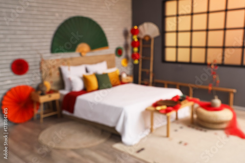 Blurred view of bedroom wit...