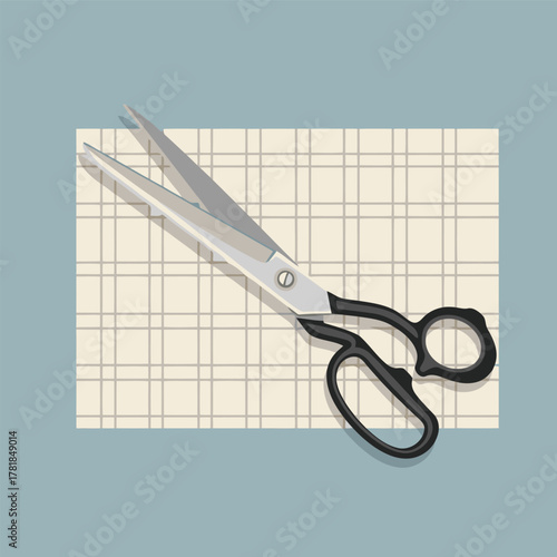 A pair of tailor's shears with black handles resting on a piece of gridded pattern paper against a plain background.