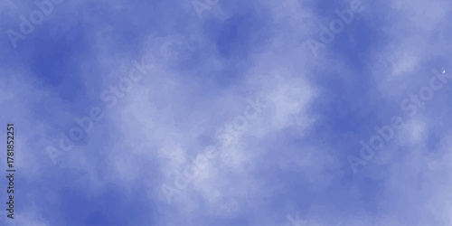 A beautiful day with white clouds drifting across the clear blue sky