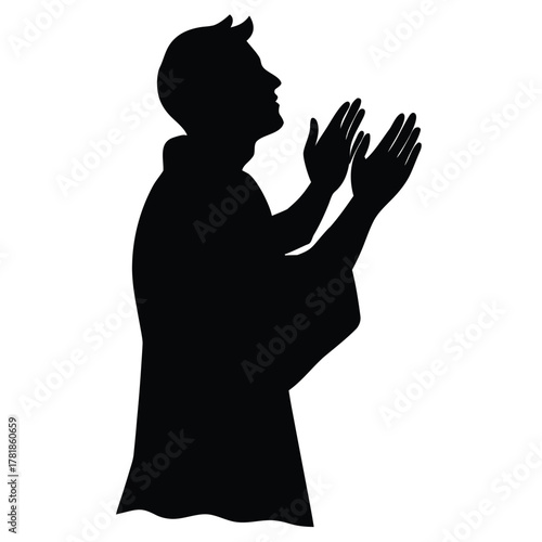 Silhouette of Man Praying With Raised Hands Showing Respect or Worshiping