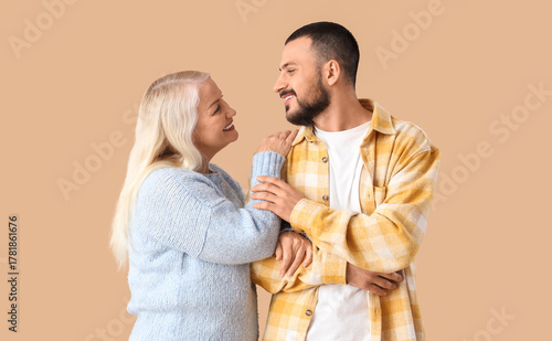 Young man with his mother h...