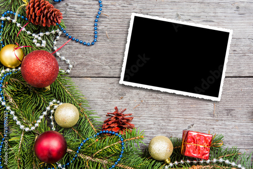 Christmas background with decorations and gift boxes on wooden board, empty space for text