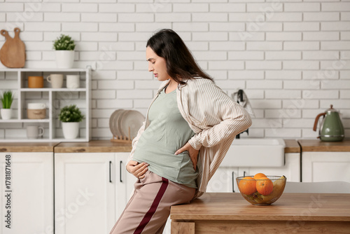 Young pregnant woman suffer...