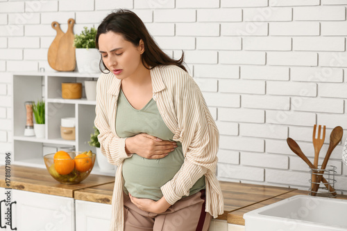 Young pregnant woman suffer...