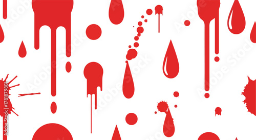 Red drops and splatters of different sizes scattered on a white backdrop