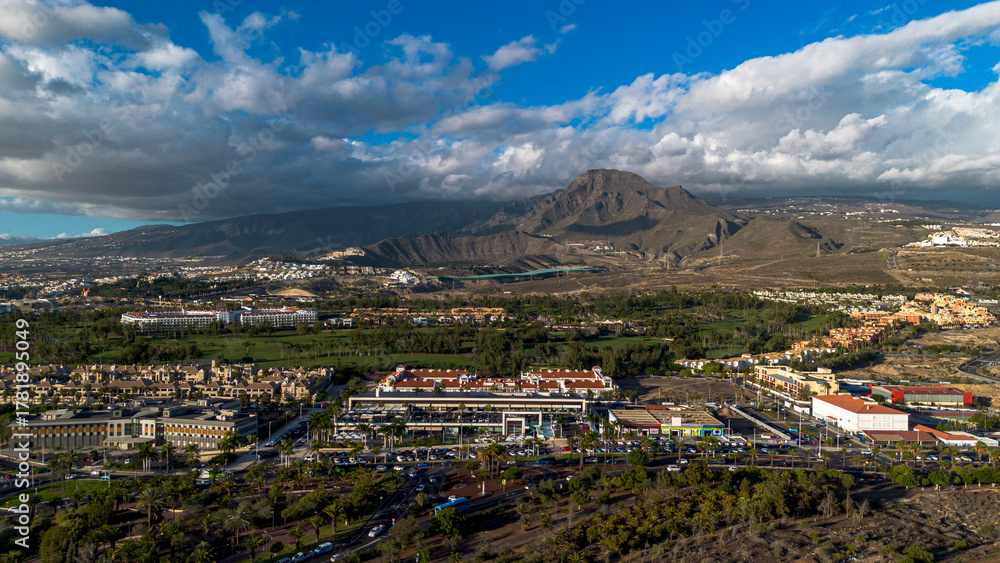 Obraz premium Panorama of the town of Los Cristianos with a volcano in the background. Tenerife, Canary Islands