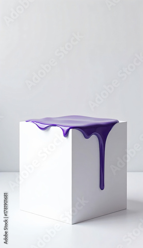 pure white cube on a neutral light grey background with glossy purple paint dripping gently on the top edge of the cube