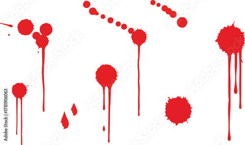 Red paint splatters drip on a white background
