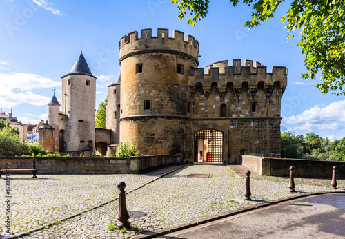 The Germans' Gate is a medieval bridge castle and city gate in Metz, France, with two round towers and two gun bastions, relic of the fortifications.