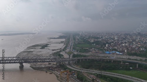 Evening view of Patna Marine Drive with JP Ganga Setu stretching across the Ganges in Bihar, India. A blend of modern infrastructure and riverside beauty, capturing city life, skyline, and tranquil wa