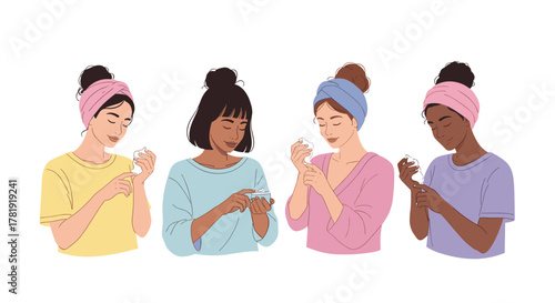Diverse women applying hand cream during self-care, white background