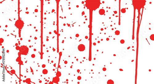 Red splatters and drips against a white background creating a textured and dynamic pattern