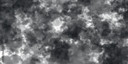 Abstract black and white cloudy texture resembling stormy smoke or marble surface, dramatic lighting and soft diffusion, chaotic yet artistic natural pattern background.