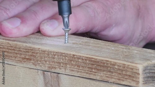 Struggling to screw in a fastener as the screwdriver spins without gripping in a wooden surface