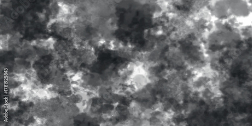 dramatic cloud mass with intense contrasts of deep gray and bright highlights, forming a turbulent, storm-like atmosphere with rich, textured patterns.