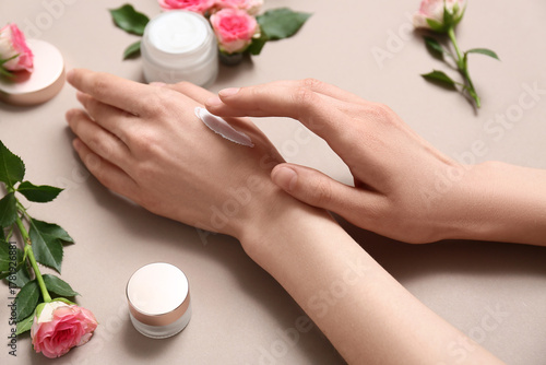 Woman applying hand cream f...