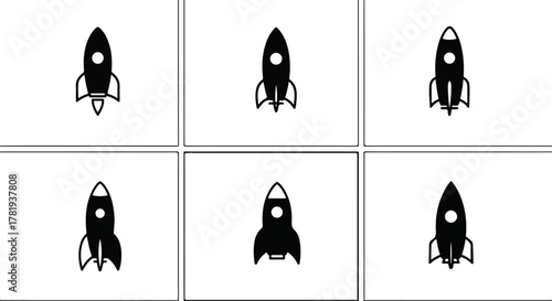 Abstract silhouettes of rocket ships on black background