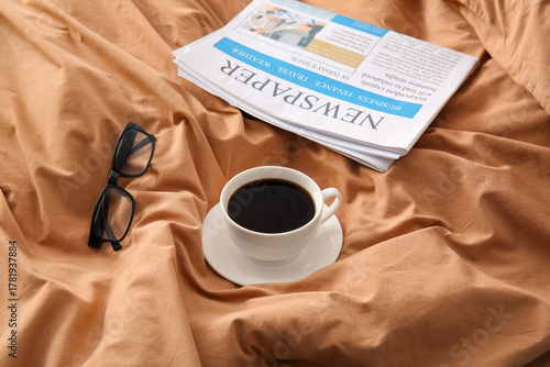Cup of coffee with newspape...