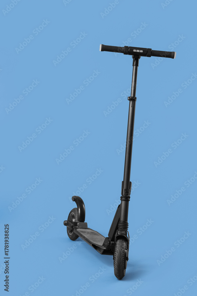 Fototapeta premium Modern electric scooter on blue background