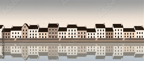 Serene waterfront houses reflecting in calm water at dawn