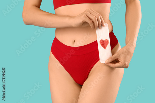 Young woman in panties hold...
