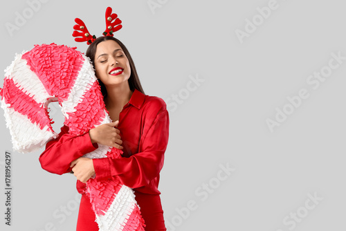 Happy young woman with rein...