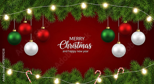 Christmas background with ornaments, fir branches and lights on red background