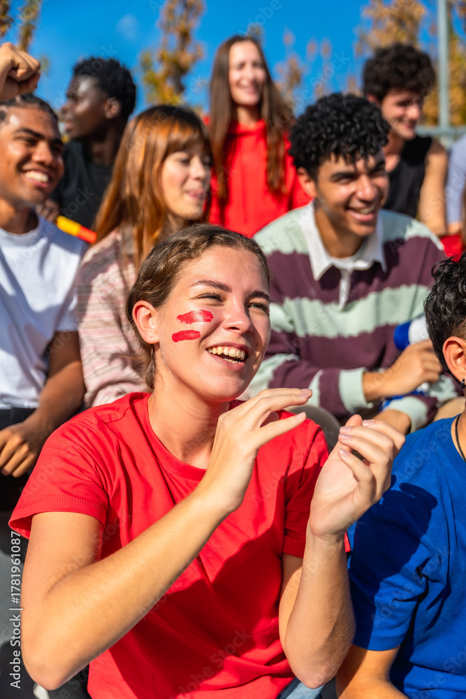 Fototapeta premium Diverse friends enjoying sports event clapping and cheering