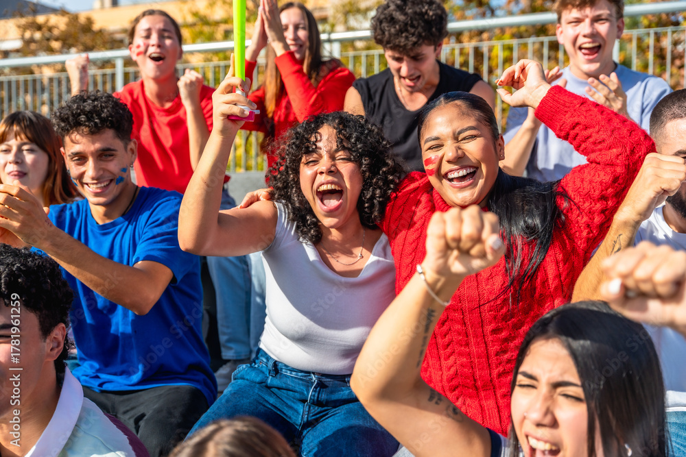 Fototapeta premium Excited young people cheering at sporting event
