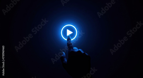 Hand pressing glowing play button