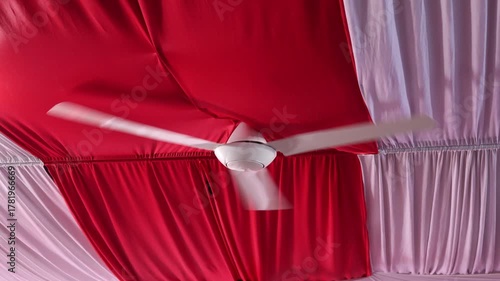 Modern hanging electric fan on the ceiling
