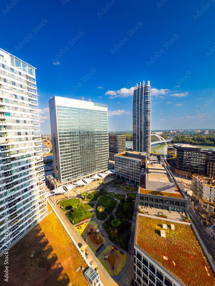Fototapeta premium Aerial view of modern city district in Bratislava. High angle view of modern district with skyscrapers in Bratislava, Slovakia.