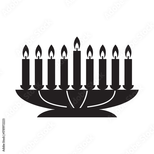 Silhouette of a lit hanukkah menorah with nine candles