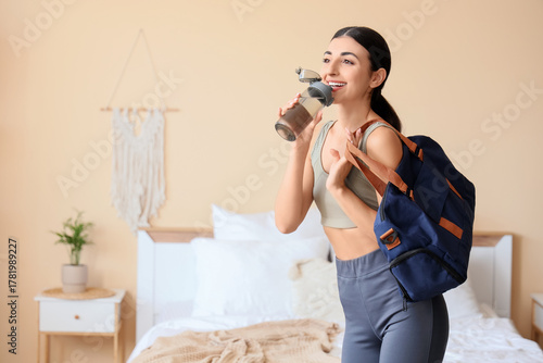 Sporty young woman with bot...