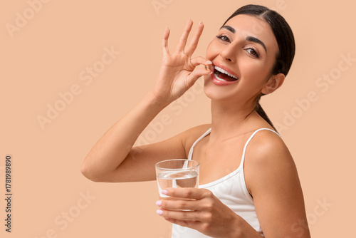 Young woman with glass of w...