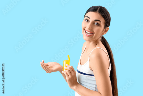Young woman with vitamin E ...