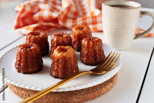 Local French dessert canele served on a plate