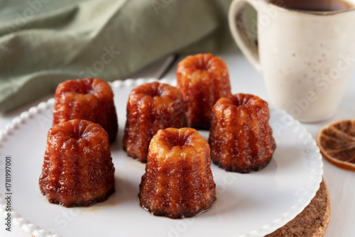 Local French dessert canele served on a plate