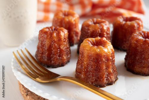 Local French dessert canele served on a plate