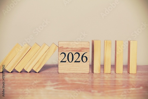 Year 2026. Stopping falling wooden blocks in 2026. Business concept. Business security, Risk management, insurance, resolution, strategy, solution, goal, new year, new challenges, Happy new year