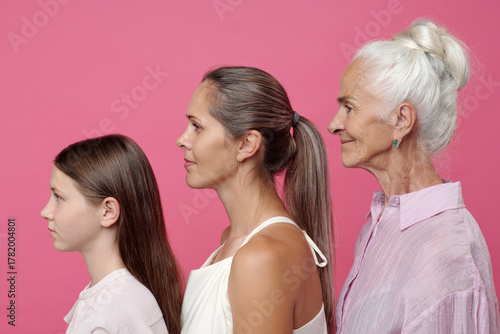 Obraz na płótnie Caucasian child girl, Caucasian young adult woman, and Caucasian senior woman st