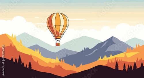 Hot air balloon flying over autumn mountains at sunset  